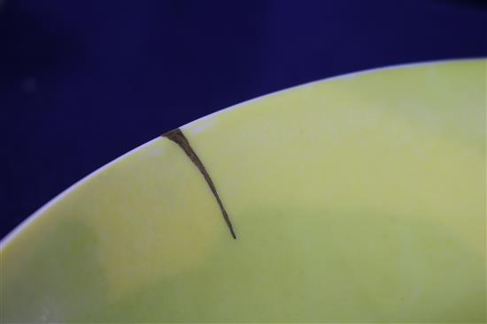 A Chinese yellow glazed dish, Jiaqing mark, gilt repair